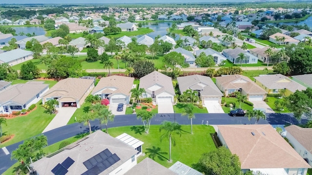 590 NW Cortina Ln, Port Saint Lucie, FL 34986 - aerial perspective of suburban area with a nearby body of water
