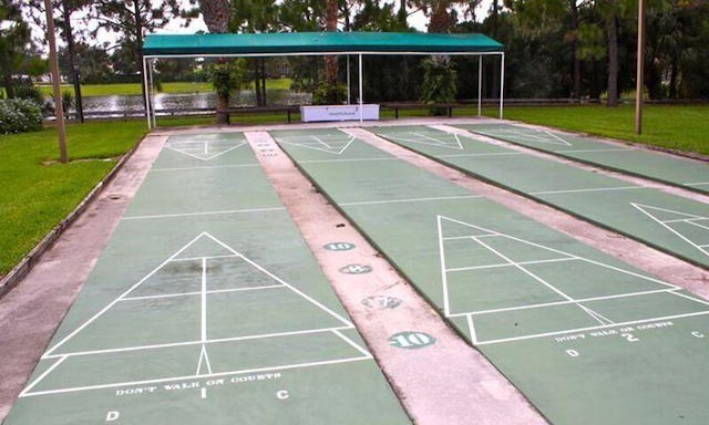 590 NW Cortina Ln, Port Saint Lucie, FL 34986 - view of community with a yard, a water view, and shuffleboard