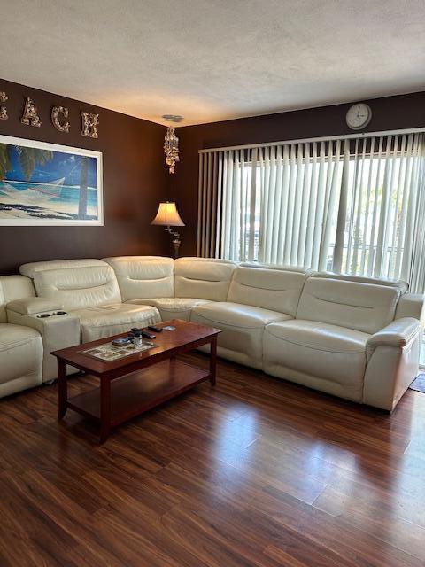 400 Northlake Ct Unit 201, North Palm Beach, FL 33408 - living room with wood finished floors and a textured ceiling