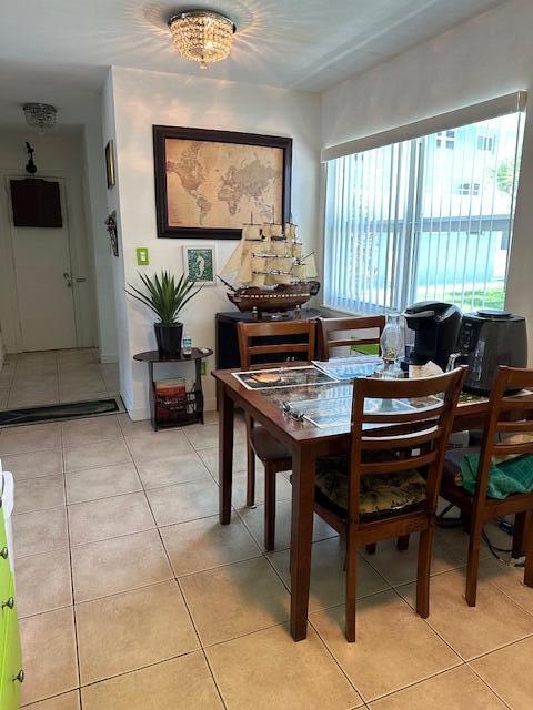 400 Northlake Ct Unit 201, North Palm Beach, FL 33408 - dining space with light tile patterned floors
