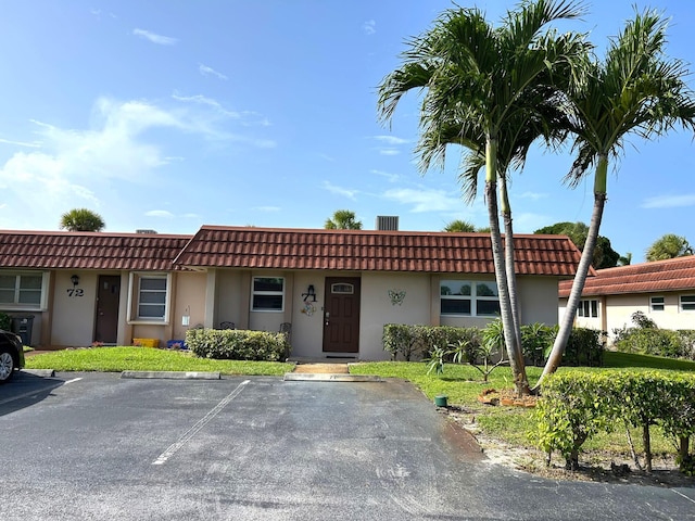 5725 Fernley Dr E Unit 71, West Palm Beach, FL 33415 - multi unit property with uncovered parking, a tile roof, and stucco siding