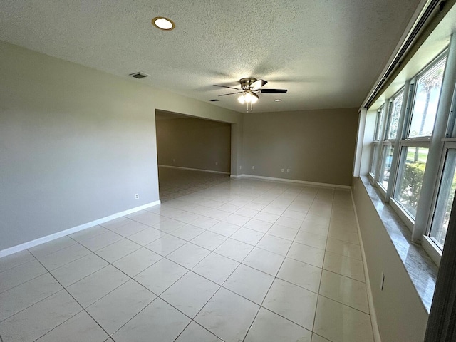 5725 Fernley Dr E Unit 71, West Palm Beach, FL 33415 - unfurnished room featuring a textured ceiling, ceiling fan, baseboards, light tile patterned flooring, and recessed lighting