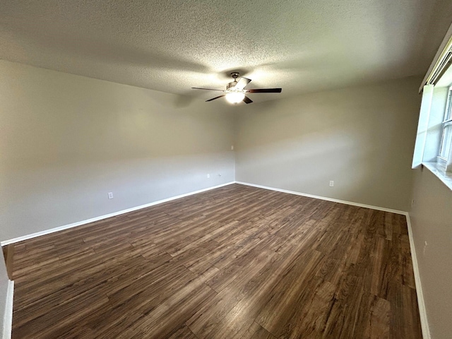 5725 Fernley Dr E Unit 71, West Palm Beach, FL 33415 - spare room featuring ceiling fan, dark wood-style floors, baseboards, and a textured ceiling
