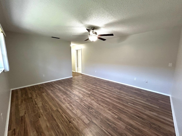 5725 Fernley Dr E Unit 71, West Palm Beach, FL 33415 - spare room featuring a ceiling fan, dark wood-style flooring, a textured ceiling, and baseboards