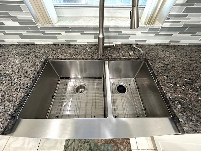 5725 Fernley Dr E Unit 71, West Palm Beach, FL 33415 - kitchen view of a sink, tasteful backsplash, and dark stone countertops