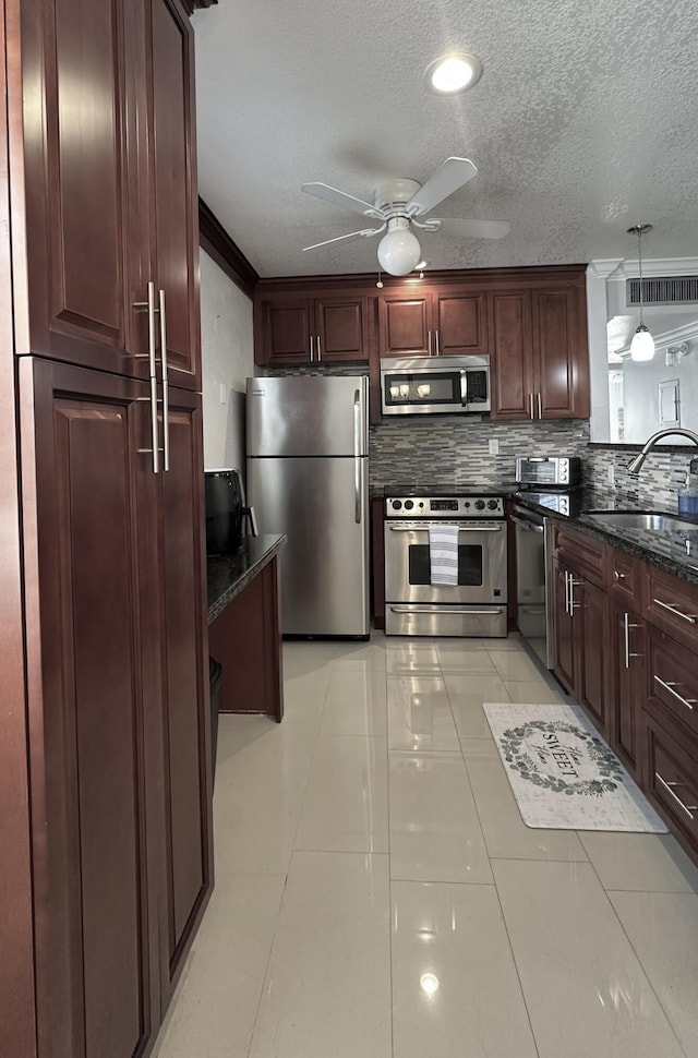 420 Normandy I 420, Delray Beach, FL 33484 - kitchen with appliances with stainless steel finishes, a sink, decorative backsplash, a ceiling fan, and light tile patterned floors