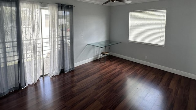 420 Normandy I 420, Delray Beach, FL 33484 - empty room with dark wood-type flooring, baseboards, ceiling fan, and ornamental molding