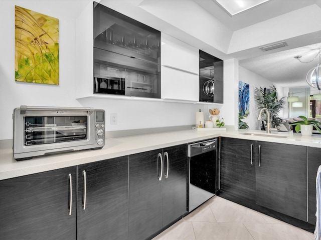 2027 SW 15th St Unit 177, Deerfield Beach, FL 33442 - kitchen with dishwasher, a sink, light countertops, and modern cabinets