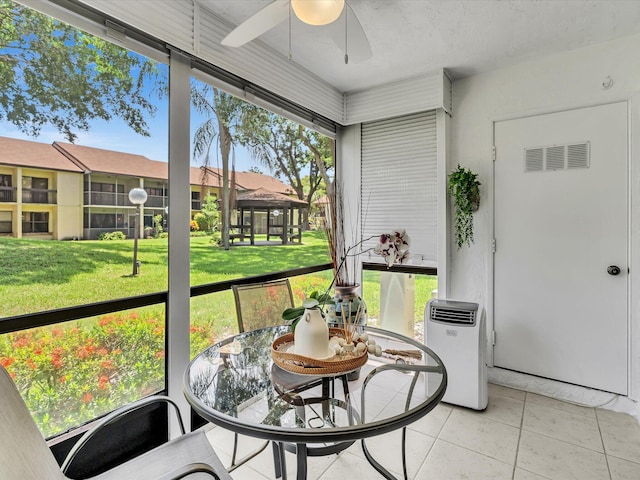 2027 SW 15th St Unit 177, Deerfield Beach, FL 33442 - sunroom / solarium featuring a ceiling fan and outdoor dining space