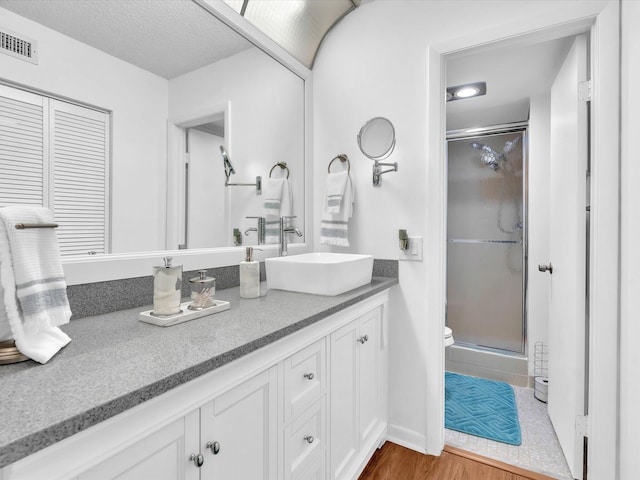 2027 SW 15th St Unit 177, Deerfield Beach, FL 33442 - bathroom featuring vanity, a shower stall, wood finished floors, and toilet