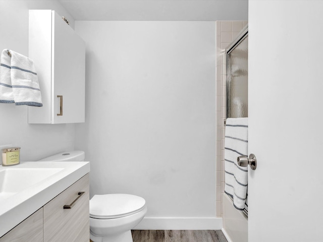 2027 SW 15th St Unit 177, Deerfield Beach, FL 33442 - bathroom featuring wood finished floors, vanity, toilet, and baseboards