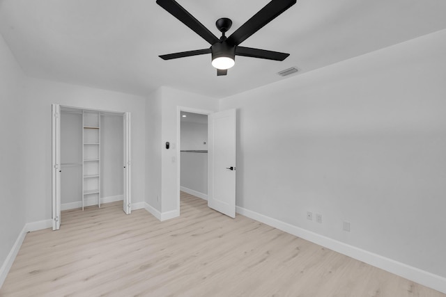 2033 SW Justison Ave, Port Saint Lucie, FL 34953 - unfurnished bedroom featuring wood finished floors, baseboards, a closet, and a ceiling fan