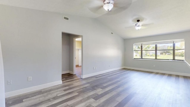 2569 SE Grand Dr, Port Saint Lucie, FL 34952 - unfurnished room featuring ceiling fan, wood finished floors, lofted ceiling, and baseboards