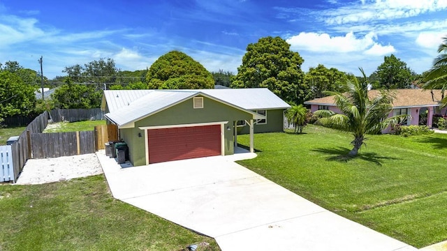 2569 SE Grand Dr, Port Saint Lucie, FL 34952 - single story home featuring a garage, driveway, and stucco siding