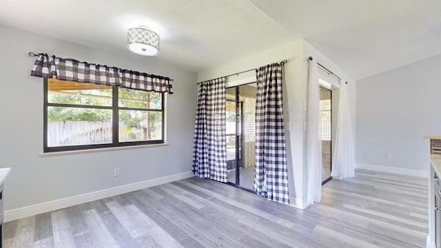 2569 SE Grand Dr, Port Saint Lucie, FL 34952 - spare room with light wood-type flooring and baseboards