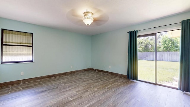2569 SE Grand Dr, Port Saint Lucie, FL 34952 - spare room with ceiling fan, wood finished floors, and baseboards
