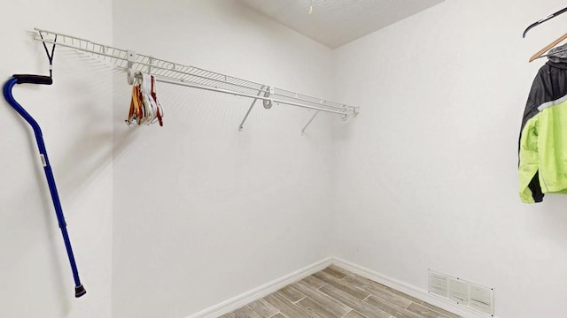 2569 SE Grand Dr, Port Saint Lucie, FL 34952 - walk in closet with wood finished floors