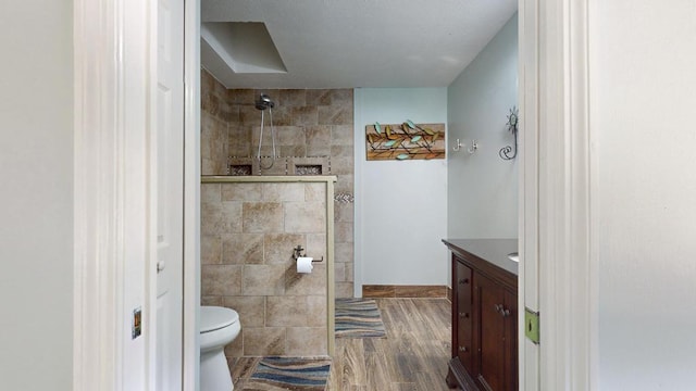 2569 SE Grand Dr, Port Saint Lucie, FL 34952 - full bathroom with vanity, walk in shower, wood finished floors, and toilet