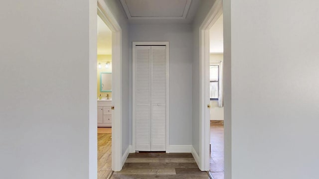 2569 SE Grand Dr, Port Saint Lucie, FL 34952 - corridor with wood finished floors and a sink