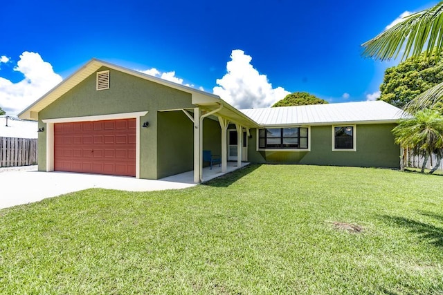 2569 SE Grand Dr, Port Saint Lucie, FL 34952 - single story home featuring an attached garage, stucco siding, and driveway