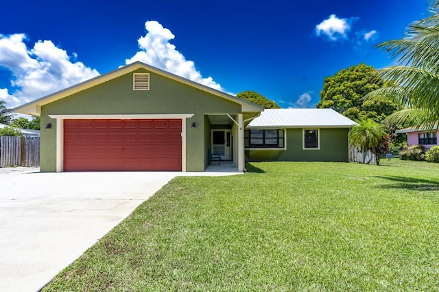 2569 SE Grand Dr, Port Saint Lucie, FL 34952 - ranch-style home with stucco siding, an attached garage, and concrete driveway