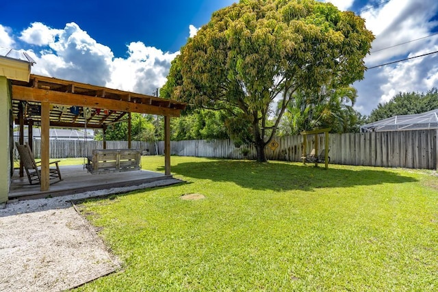 2569 SE Grand Dr, Port Saint Lucie, FL 34952 - view of yard featuring a wooden deck and a jacuzzi