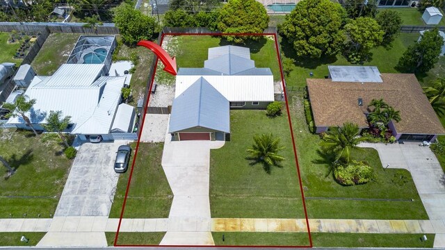 2569 SE Grand Dr, Port Saint Lucie, FL 34952 - aerial view of property and surrounding area with property boundaries highlighted