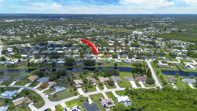 2569 SE Grand Dr, Port Saint Lucie, FL 34952 - aerial overview of property's location featuring a nearby body of water and nearby suburban area