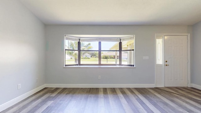 2569 SE Grand Dr, Port Saint Lucie, FL 34952 - empty room featuring wood finished floors and baseboards