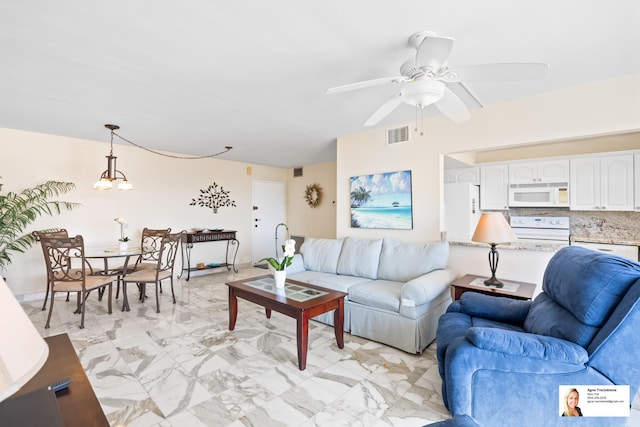 137 Golden Isles Dr Unit 804, Hallandale Beach, FL 33009 - living room featuring a ceiling fan and light marble finish floors