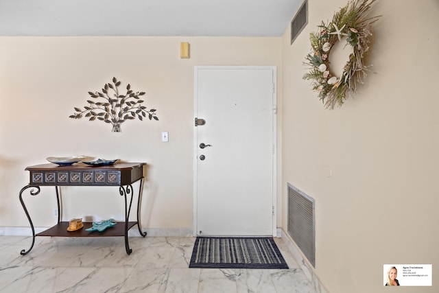 137 Golden Isles Dr Unit 804, Hallandale Beach, FL 33009 - entryway with marble finish floors and baseboards