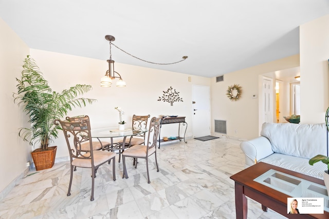 137 Golden Isles Dr Unit 804, Hallandale Beach, FL 33009 - dining space featuring light marble finish flooring