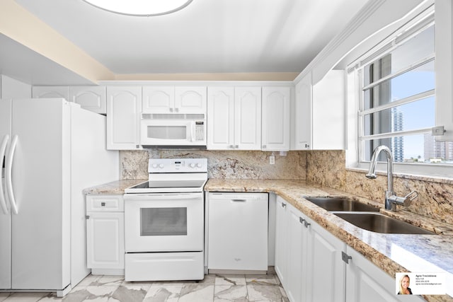 137 Golden Isles Dr Unit 804, Hallandale Beach, FL 33009 - kitchen featuring white appliances, a sink, light marble finish flooring, and white cabinetry