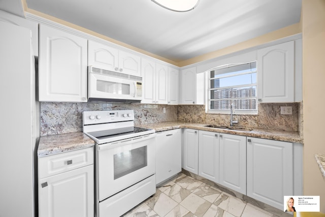 137 Golden Isles Dr Unit 804, Hallandale Beach, FL 33009 - kitchen with white appliances, a sink, and white cabinets