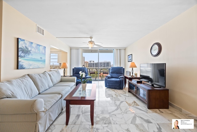 137 Golden Isles Dr Unit 804, Hallandale Beach, FL 33009 - living room featuring ceiling fan, light marble finish floors, and floor to ceiling windows