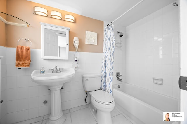 137 Golden Isles Dr Unit 804, Hallandale Beach, FL 33009 - full bath with toilet, shower / bathtub combination with curtain, tile walls, wainscoting, and tile patterned floors