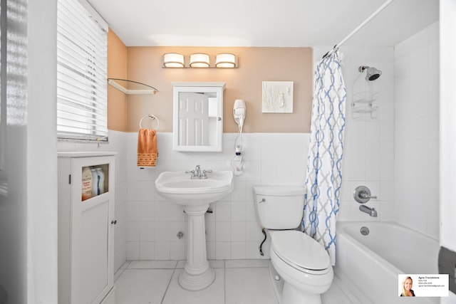 137 Golden Isles Dr Unit 804, Hallandale Beach, FL 33009 - bathroom featuring toilet, shower / tub combo, tile walls, a wainscoted wall, and tile patterned floors
