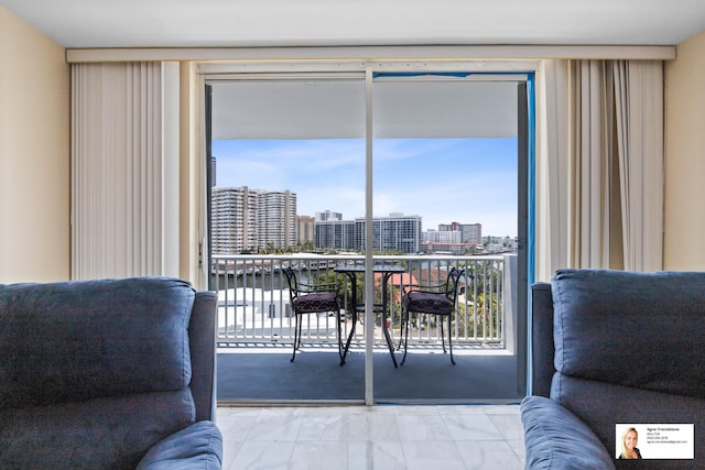 137 Golden Isles Dr Unit 804, Hallandale Beach, FL 33009 - living area with marble look tile flooring and a city view