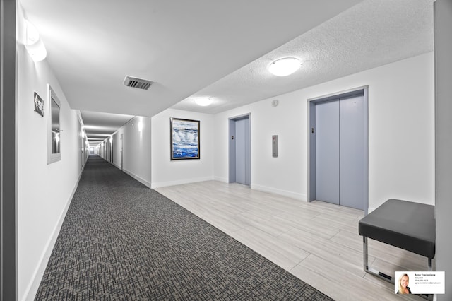 137 Golden Isles Dr Unit 804, Hallandale Beach, FL 33009 - building lobby with a textured ceiling