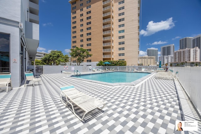 137 Golden Isles Dr Unit 804, Hallandale Beach, FL 33009 - community pool featuring a patio