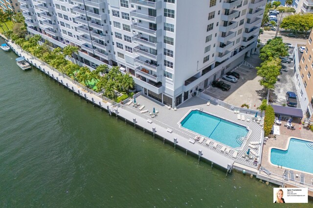 137 Golden Isles Dr Unit 804, Hallandale Beach, FL 33009 - bird's eye view of apartment complex, a pool area, and a nearby body of water