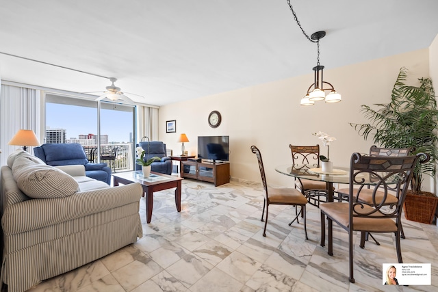 137 Golden Isles Dr Unit 804, Hallandale Beach, FL 33009 - living room featuring light marble finish flooring, ceiling fan, and floor to ceiling windows