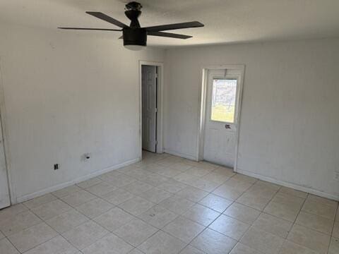 312 NW 18th Ct, Pompano Beach, FL 33060 - unfurnished room with a ceiling fan, baseboards, and light tile patterned floors