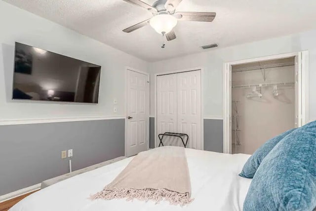 2550 SE Calais St, Port Saint Lucie, FL 34952 - bedroom with multiple closets and a ceiling fan