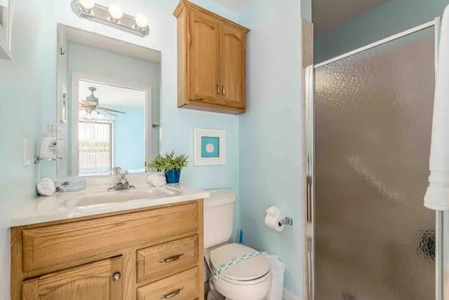 2550 SE Calais St, Port Saint Lucie, FL 34952 - full bath featuring vanity, a shower stall, toilet, and ceiling fan