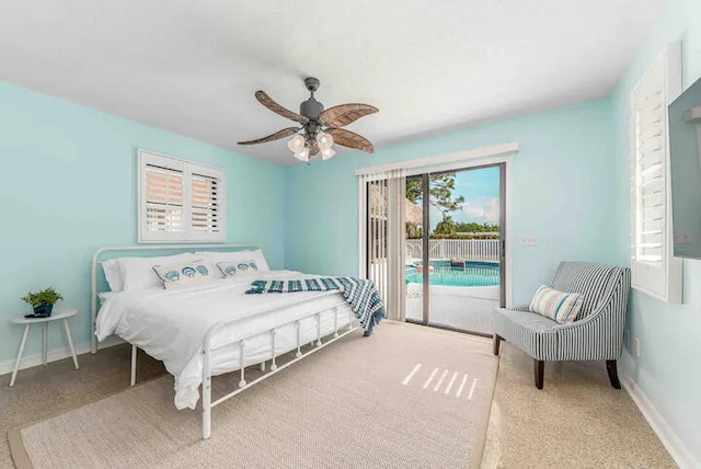 2550 SE Calais St, Port Saint Lucie, FL 34952 - bedroom with access to exterior, carpet, ceiling fan, and baseboards