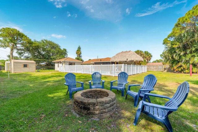 2550 SE Calais St, Port Saint Lucie, FL 34952 - view of yard featuring a fire pit and an outdoor structure