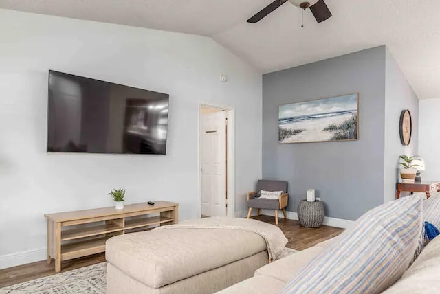 2550 SE Calais St, Port Saint Lucie, FL 34952 - living room featuring lofted ceiling, wood finished floors, a ceiling fan, and baseboards