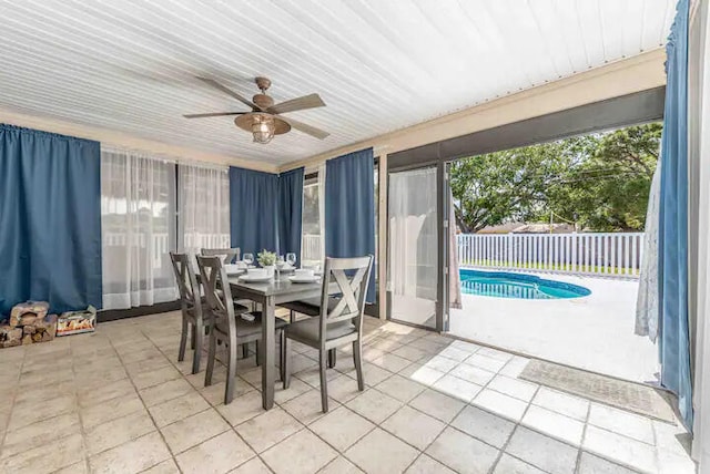 2550 SE Calais St, Port Saint Lucie, FL 34952 - dining space with light tile patterned flooring, ceiling fan, healthy amount of natural light, and a sunroom