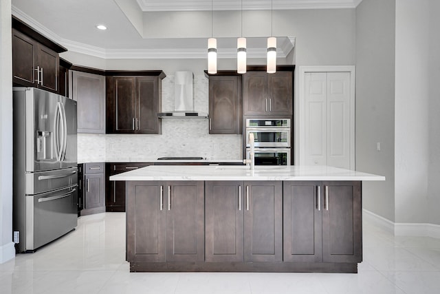 10523 Vignon Ct, Wellington, FL 33449 - kitchen with appliances with stainless steel finishes, wall chimney range hood, tasteful backsplash, dark brown cabinets, and crown molding